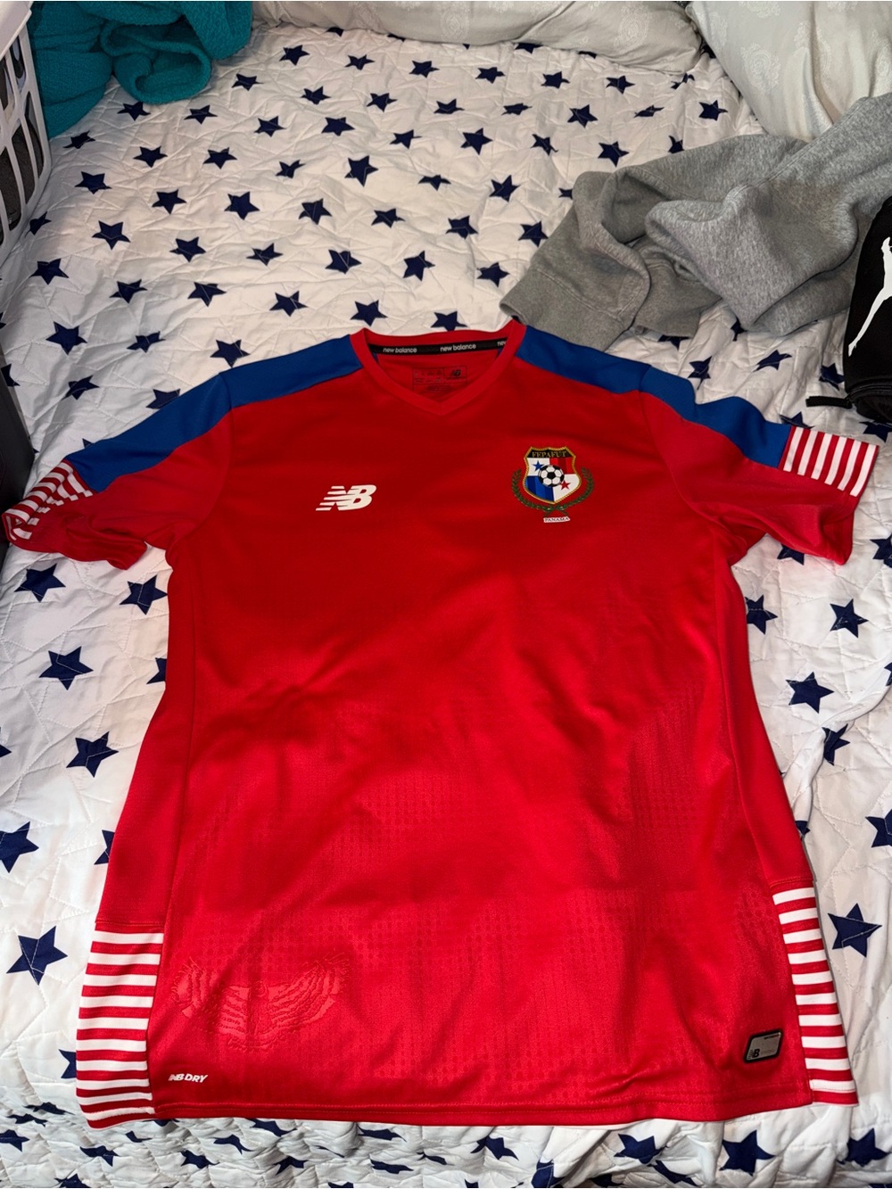 New Balance Red Soccer Jersey with Blue Shoulder Panels and White Accents